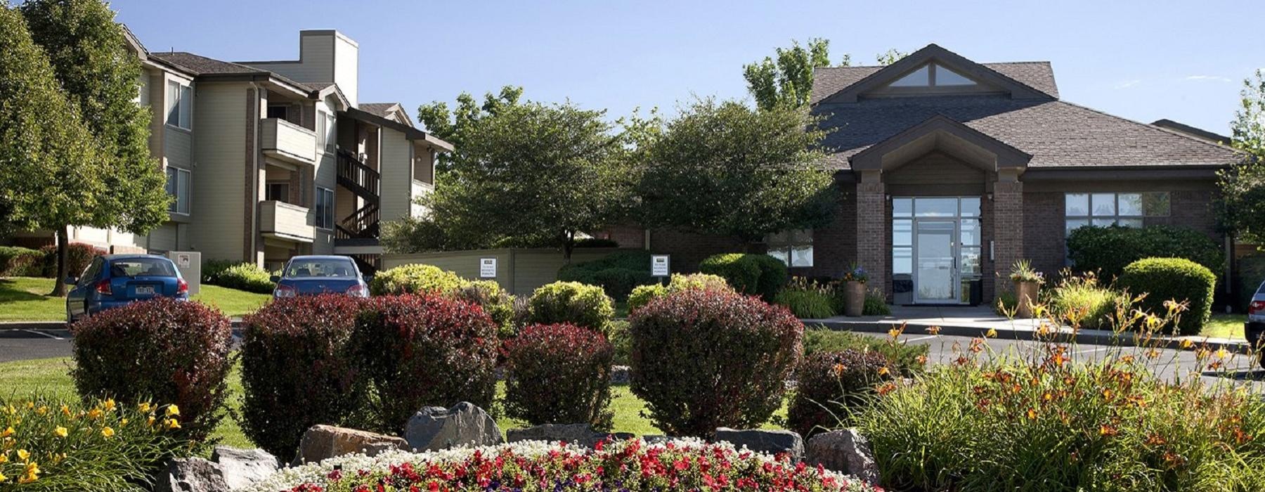 a large house with a garden in front of it