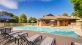 a pool surrounded by chairs