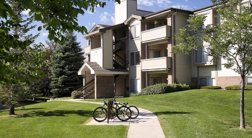 bicycles parked in front of a building